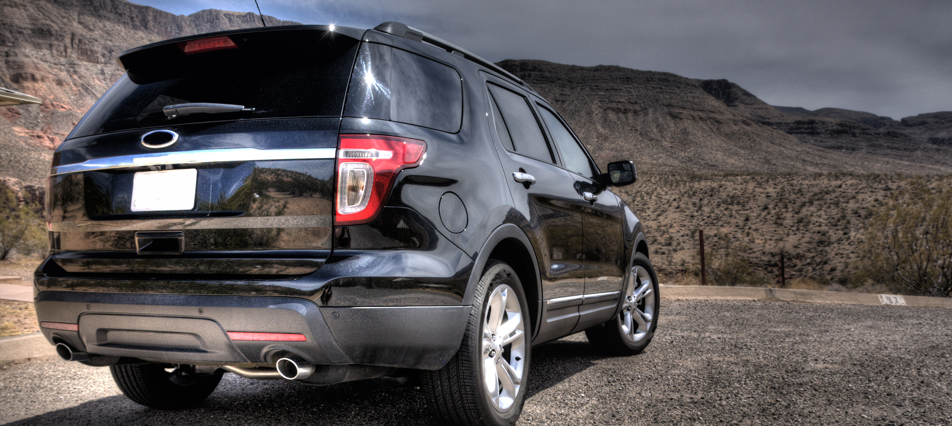SUV parked on gravel road